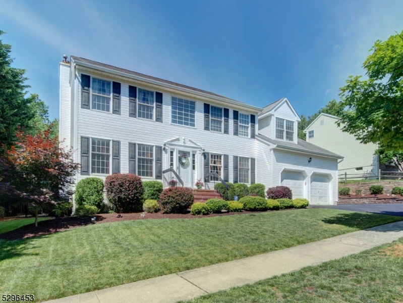 Welcome home to this beautiful 4 bedroom, 2.5 bath Colonial in the desirable Hunters Ridge community. This beauty provides your own "staycation" with its spectacular back yard private oasis. Property goes beyond retaining wall...2 sets of steps lead to open property perfect for play.  The free form in-ground pool is heated and has a lovely waterfall that sounds so relaxing. Electric awning opens over deck, The pool liner is four years old.  The yard is surrounded on all sides with dense plantings and trees providing total privacy. All of the landscaping is well maintained and plush. As you enter the home, expect to be impressed by its two story foyer. The first level features formal living & dining rooms, spacious kitchen with center island, family room with fireplace, powder room and laundry room. Ascend to the second level to find double door entry to primary bedroom and ensuite. It also has a generous sized walk in closet. Three other spacious bedrooms and main bath complete the second floor. Both showers have just been replaced. Enjoy the additional living space in full finished basement. It features a separate room that can be used for many purposes including  home office or exercise room. The remainder of the basement is set up as a recreation room and media room.  Home highlights also include newer AC & hot water heater installed 2020, wood flooring on first floor just refinished, recessed lighting, moldings, side 2 car garage, expanded driveway & public utilities.