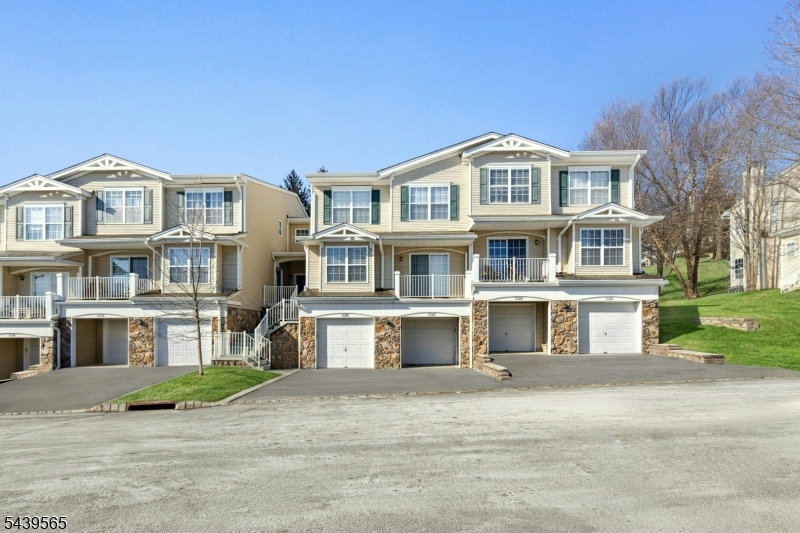 Immaculate, move-in-ready townhouse offering style, comfort, and convenience! This beautifully updated and maintained 2-bedroom, 2.5-bath home features approximately 1,200 square feet of finished living space and a thoughtfully designed layout you'll love. The main level welcomes you with a bright, open-concept feel featuring a spacious living room with a cozy gas fireplace, separate dining area, and beautifully updated kitchen perfect for everyday living and entertaining. Step outside onto the deck overlooking beautiful open space, creating the perfect place to relax and unwind. Enjoy the convenience of a main-level laundry room, pantry, and excellent storage throughout. Upstairs, the spacious primary suite features a large walk-in closet and impressive en-suite bath complete with a soaking tub and separate stall shower. A generously sized second bedroom and additional full bath complete the upper level. The finished basement adds valuable additional living space with direct garage entry and endless possibilities for a family room, home office, gym, or recreation area. Additional highlights include an attached garage with a pre-installed EV charging plug and a private driveway. Enjoy fantastic community amenities including an outdoor pool, playground, and tennis courts, plus a convenient location close to shopping, dining, and major highways for easy commuting. Beautifully maintained, tastefully updated, and truly move-in ready   the perfect blend of comfort and lifestyle!