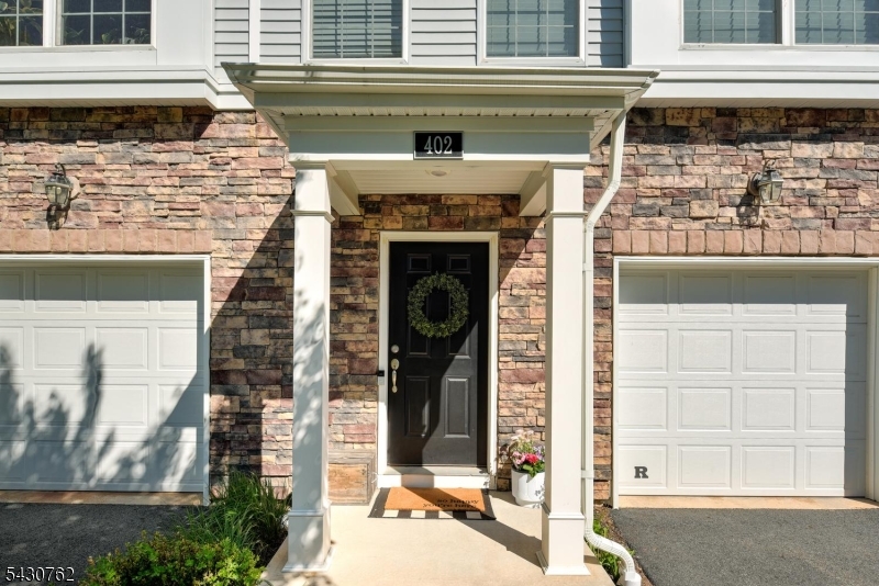 Welcome home to this beautifully maintained townhome in the highly desirable Fox Hollow community of Branchburg! Offering 2 spacious bedrooms, a versatile den/office, 3 full bathrooms, and 1 half bath. This exceptional home combines elegance, comfort, and flexible living space. The sun-filled main level features an open-concept design with soaring ceilings, oversized windows, and seamless flow perfect for both everyday living and entertaining. The gourmet eat-in kitchen boasts stainless steel appliances, abundant cabinetry, and a large pantry. A private deck ideal for outdoor dining or relaxing is right off the kitchen. The dining area opens effortlessly into the bright and inviting living room filled with natural light. Upstairs, the spacious primary suite offers a peaceful retreat with two closets and a private en-suite bath. An additional bedroom, full bath, and flexible den/office complete the upper level. The finished walk-out ground level provides exceptional versatility with a large recreation room, full bathroom, and backyard access perfect for guests, a home office, gym, or media room. Community boasts basketball courts, playground and abundance of sidewalks. Conveniently located near shopping, restaurants, major highways including Routes 287, 78 and 22, and transportation to NYC, bus or train.  This move-in ready home offers the perfect blend of convenience, style, and spacious living in one of Branchburg's most sought-after communities.