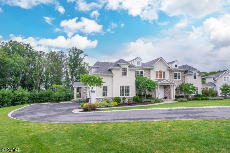 Magnificent  & Luxurious this Center Hall Colonial offers 8,780SQFT Including Walk-out Finished Basement! Green Energy Efficient & Custom Home. Crestron Home Automation System, Fresh Air Intake,Marble BathRms & Whole House Generator! Grand two-story foyer, 10ft Ceilings on 1st floor, 9ft Ceilings on 2nd, Coffered & Tray Ceilings. High-end Chef's kitchen w/ Breakfast Room & Huge Center Island Breakfast Bar, Top of the line appliances, marble/stone counters, 2 walk-in pantries. Separate Side Entrance w/Mudroom, 1st Floor Office & guest suite. Primary suite w/Tray Ceiling & Fireplace. Marble & radiant floors in bathroom & 2 Walk-in Closets. 4 Additional BedRms w/ en-suite baths & walk-in closets, laundry room, bonus room & rear staircase. Huge Finished walkout BSMNT w/nanny suite. A Prime Home in Great Location!