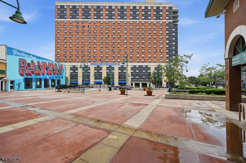 *FIRST MONTH RENT FREE* Built in 2023, PH14 is a premium penthouse with a unique layout, unobstructed sunset views of the Watchung Mountains, and impressive NYC skyline views. Features include 12-foot-plus ceilings, oversized windows, double-height cabinetry, custom built-in storage, a full quartz backsplash, modern appliances, and an open-concept living and dining area filled with natural light. The spacious primary suite includes a primary bathroom with a double-sink vanity and LED mirrors. A generously sized 2nd bedroom and full bathroom provide flexibility for additional living space, guests, or a home office. Additional features include an in-unit washer and dryer and a private storage locker on the same floor. Penthouse residents enjoy exclusive access to a private lounge and rooftop terrace with grilling areas, plus complimentary use of the Watt Hotel gym. Located across from the Rahway NJ Transit station, with an approximately 37-minute commute to NYC, and steps from dining, shopping, and entertainment in the Downtown Arts District.