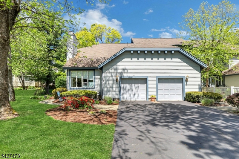 Welcome to Ridge Rise, a townhouse community with private tree-lined streets.  This beautifully maintained end unit features sun-filled living space including open  living/dining room area with gas fireplace.  The kitchen includes ss appliances, granite counter top dividing  space for table, or family room use.  There is a large slider that opens to a deck overlooking a wooded area.  Washer/dryer w/open storage in kitchen. Primary ensuite on first floor has two closets bath includes jetted tub, stall shower and Main floor finishes off with an updated powder room.Second floor features balcony office with built-in furniture.  Second ensuite bedroom has large walk-in cedar closet.  Recently updated bath. Hardwood flooring on main and second floorsFinished carpeted basement has a bar, half bath, and storage.