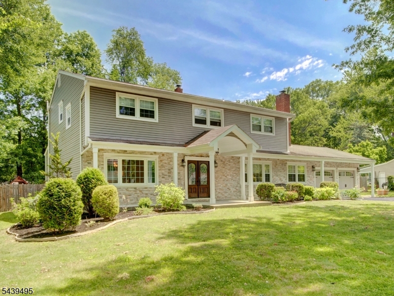 Nestled on a beautifully landscaped lot in one of Parsippany's most sought-after neighborhoods, this exceptional Colonial combines timeless elegance with today's most desirable upgrades. Thoughtfully renovated with high-end finishes throughout, this home offers a spacious, open-concept layout designed for both comfortable everyday living and effortless entertaining. At the heart of the home is a stunning chef's kitchen featuring custom cabinetry, premium granite countertops, stainless steel appliances, 2 sinks, 2 dish washers, and an oversized center island that invites gathering and conversation. The kitchen flows seamlessly into a sun-drenched dining area and a generous recreation room, where glass doors open to a beautifully maintained backyard, creating the perfect indoor-outdoor lifestyle. Upstairs, you'll find three well-appointed bedrooms, a beautifully updated main bath, and a luxurious primary suite designed as a private retreat. An adjoining bonus space offers incredible flexibility and can serve as a dressing room, home office, nursery, fitness area, or tranquil sitting room. With its desirable location, quality renovations, versatile living spaces, and inviting atmosphere, this home presents a rare opportunity to enjoy comfort, style, and convenience in one of Parsippany's most established neighborhoods. Convenient to parks, schools, shopping, NJ Transit.