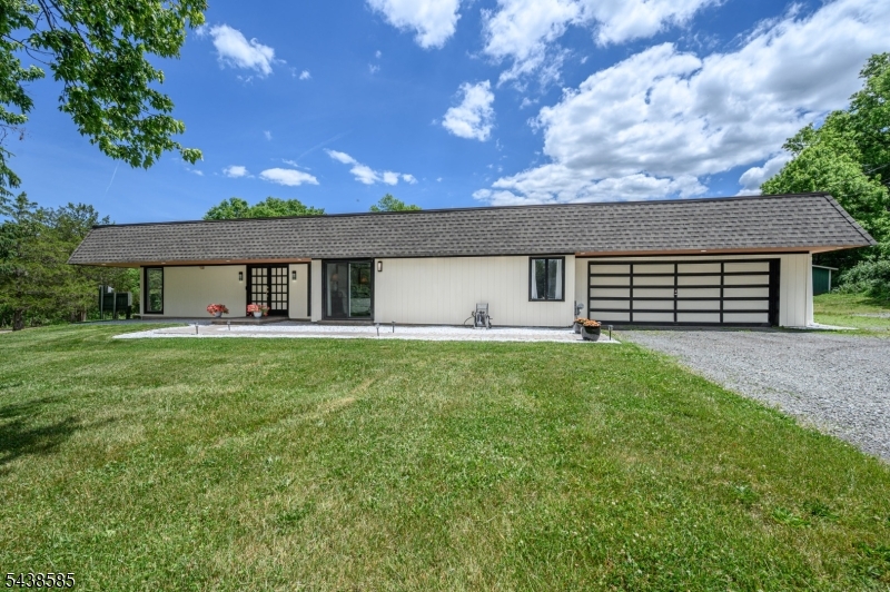 Dream Homes Exist! Beautiful 4 Bed 2 Bath Turn-Key Custom Ranch w/Master Suite & Oversized Garage in Whitehouse Station, sure to impress! Set back from the road on a private, park-like lot, meticulously maintained inside & out w/curb appeal. Step in to find a spacious & sophisticated interior w/generous rm sizes, Luxury hardwood & tile floors that shine, & plenty of natural light all through. Double door entry & tiled foyer give way to a light & bright living rm w/sliders to the exterior & stunning stone accent wall. Country Eat-in-Kitchen offers SS appliances, ample cabinet storage, luxury vinyl tiled flr w/decorative backsplash, a wraparound breakfast bar , & sun soaked dining area. The EIK opens to the family rm, holding a cozy fireplace w/stone hearth, & slider to the rear deck. Down the hall, the upgraded main bath w/luxurious spa-like jacuzzi tub + 4 generous bedrooms, inc the Master. MBR boasts a walk-in closet & ensuite bath w/steam shower & bidet, along w/its own slider to the peaceful outdoors. Dedicated laundry rm rounds out the interior. This home also features a 19.6kW Solar Lease that covers annual electric bill, NEW EPDM Roof w/40 yr warranty, outdoor LED hi hat lighting, cedar soffits, & new attic insulation. Huge backyard w/deck & barn is your blank canvas, w/plenty of space to expand, build & play. Oversized garage & driveway offers ample parking. Close to shopping, dining, & Route 22 for an easy commute. Don't miss out! A true Move-in-Ready MUST SEE!