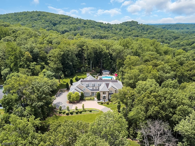 The discreetly elegant residence, located in one of Bergen County's most prestigious towns, will appeal to those looking for a luxurious and opulent home in a secluded location.  This palatial estate is tucked away on over 2.5 acres of meticulously manicured grounds boasting approximately 11,000 square feet of pure luxury. Welcome to an architectural masterpiece like no other...unparalleled in every way, built to the highest level of design standards this exquisite nine year young home features unprecedented design details throughout. Nothing short of spectacular.