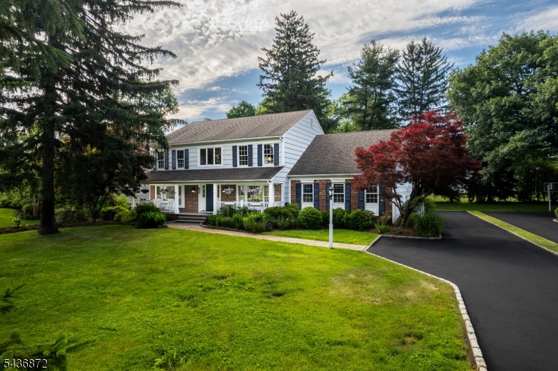 Beautifully updated and meticulously maintained, this exceptional DeMarzo 5/6 bedroom home is designed for today's lifestyle. A paver walkway lined with professionally landscaped gardens leads to a welcoming covered porch. Inside, newly refinished hardwood floors, custom moldings, and abundant natural light enhance the elegant living spaces. The grand foyer is flanked by formal living and dining rooms. French doors open to the open concept family room/kitchen. The family room has a wood-burning fireplace, marble surround, custom built-ins, wine cabinet, and views of the landscaped grounds. The updated kitchen features white soft-close cabinetry, an oversized center island, professional-grade stainless steel appliances including two dishwashers, and abundant storage. The first floor also offers a guest bedroom, full bath, upgraded laundry room, and spacious pantry. Upstairs, the luxurious primary suite includes a spa-like bath and two walk-in closets. Three additional bedrooms, an updated full bath, and a large bonus room/ 6th bedroom provide flexible living space on this level. The finished lower level offers a family room with wet bar, office, exercise area, powder room, pool room, workshop, storage, and garage access. Outdoor living is equally impressive with a Trex deck, gazebo, illuminated patio, and expansive level lawn. Combining exceptional indoor-outdoor living, this remarkable home is ready to enjoy.
