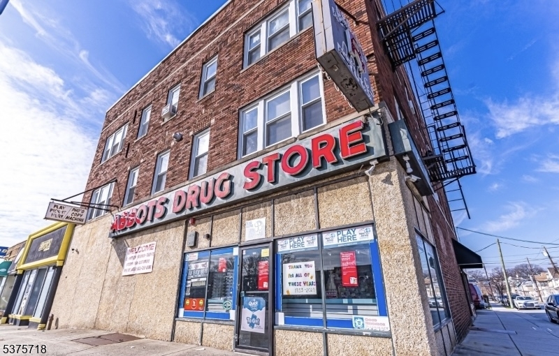 Prime investment opportunity in the heart of Belleville! This solid brick 9-unit mixed-use property sits on a prominent corner lot in the center of downtown, steps from City Hall, restaurants, grocery stores, places of worship, hospitals, and schools. The building features 6 spacious two-bedroom, one-bath apartments and 3 ground-level commercial storefronts, offering strong rental potential and a diverse income stream. Recent upgrades include a new roof (2024), newer windows, and enhanced safety improvements throughout the apartments and storage areas. With 4 on-site parking spaces, this property provides a rare convenience for tenants and commercial occupants alike. Landlord covers heat and hot water for the entire building. Located in a high-demand area with excellent foot traffic and easy access to major highways and public transportation, this property offers investors a well-maintained, income-producing asset in a thriving community.