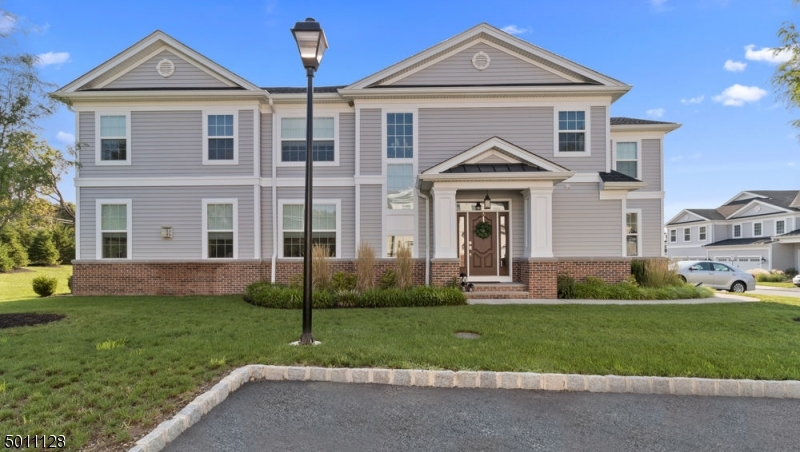 Better than brand new!  $120K in upgrades!  4 bedroom, 3.1 bath townhouse with 2 car garage & all the upgrades you can imagine!  Gracious foyer welcomes you with an open 2 story staircase, open floor plan with living room with gas fireplace dining room open to the gourmet, white kitchen with extra cabinetry, center island, stainless steel appliance, wine frig, breakfast nook with sliders to patio, office & mud room complete the first floor.  The second floor features a private master suite with crown molding, his & hers walk-in closets, & luxury bath, 3 additional bedrooms, one ensuite & a jack 'n jill bath.  Unfinished basement has enormous potential & plenty of storage.  Close to highways, NYC train less than 2.3 miles, transportation, shopping & more.  Absolutely NOTHING to do but unpack!
