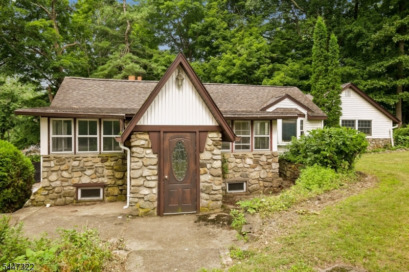Storybook charm! This inviting two-bedroom cottage sits perfectly on a spacious corner lot with ample parking. The oversized primary suite features a private ensuite bath, while the newly renovated second bathroom adds modern convenience. A bright front office provides the perfect space for working from home, a reading nook, or a hobby room.  The unfinished basement offers endless possibilities use it for storage or finish it for additional living area. Bring your vision and make this charming home your own!  At Highland Lakes Country Club, you'll enjoy access to all the community has to offer, including lakes, beaches, clubhouse amenities, and year-round recreational activities.  Property is being sold 'as-is'. See it today!