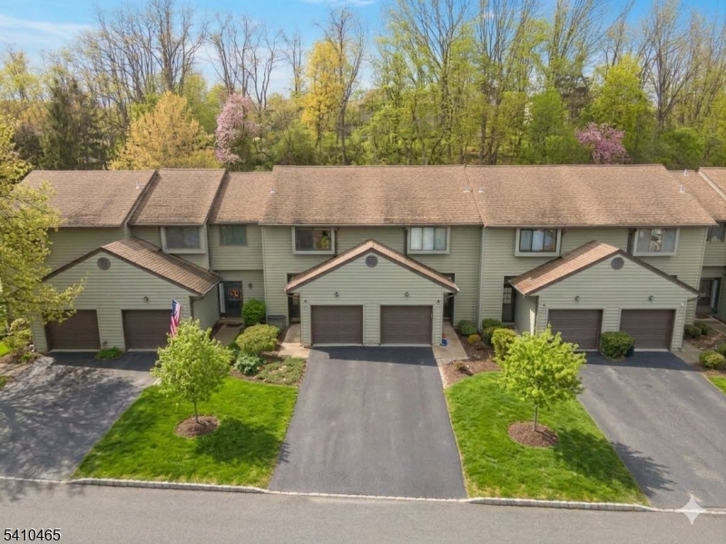 Welcome to desirable Hampton Commons in sought-after Hampton Township. This multi-level townhome offers a spacious layout with great bones and the opportunity to make it your own.A marble foyer leads to the open floor plan with Pergo flooring. The living room features a marble-framed corner wood-burning fireplace with oak mantle, vaulted ceilings, and sliding glass doors to the expanded deck. The deck is ideal for relaxing or entertaining and includes a direct gas line hookup with the grill included.The eat-in kitchen offers a pass-thru to the dining area. A brand new stove and over-the-range hood are scheduled for installation on 2/18/2026.Upstairs, the generously sized primary bedroom provides ample closet space and access to the full bath. A loft overlooking the living room offers flexible space for a home office, reading area, or guest overflow.The finished basement adds valuable living space for a recreation room, gym, media room, or additional living area. The lower level also includes the laundry area, utilities, new water heater (2025), new dryer (2025), and an owned water softener. A one-car attached garage and driveway parking add convenience.Residents enjoy community amenities including an in-ground pool, clubhouse with fitness area, playground, basketball, tennis, and pickleball courts. Minutes to shopping, dining, commuter routes, and all Sussex County has to offer.