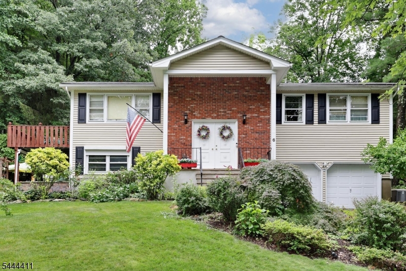 Welcome to this beautifully maintained three bedroom, two and a half bath bi-level home tucked away on a quiet cul-de-sac in one of Wanaque's most desirable neighborhoods. Step inside to find hardwood floors, ceramic tile, inviting living spaces, and many thoughtful updates throughout. The outdoor setting is truly special, featuring lush gardens, a peaceful koi pond, patio, deck, and beautiful sunset views   perfect for relaxing or entertaining. Additional highlights include a whole-house generator, water heater replaced in 2023, roof less than 10 years old, siding was updated in 2015.  A wonderful opportunity to enjoy comfort, charm, and outdoor beauty in a sought-after Wanaque location.