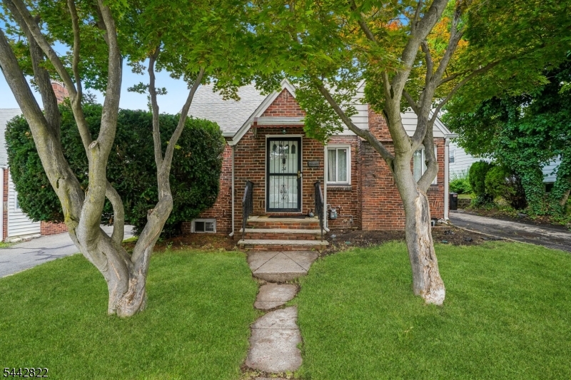 Welcome to this lovely Cape Cod-style home offering a comfortable and functional layout. The main level includes a warm and inviting living room with a cozy fireplace, an eat-in kitchen, a spacious formal dining room, one spacious bedroom, and a full bathroom ideal for guests or one-level living. Upstairs, you'll find two generously sized bedrooms, offering privacy and flexibility for guests, or a home office. Step outside to enjoy the huge backyard, perfect for entertaining, gardening, outdoor activities, or simply relaxing. This home combines classic charm with versatile living spaces, making it a wonderful place to call home, and also features a finished basement with a recreation room, utility room, laundry area, and a convenient powder room. Close to major highways including the Garden State Parkway, Route 3, Route 46, and Interstate 280, making travel throughout Northern New Jersey and New York City a breeze. Also situated within easy reach of Newark Liberty International Airport, shopping, dining, parks, and other local amenities.