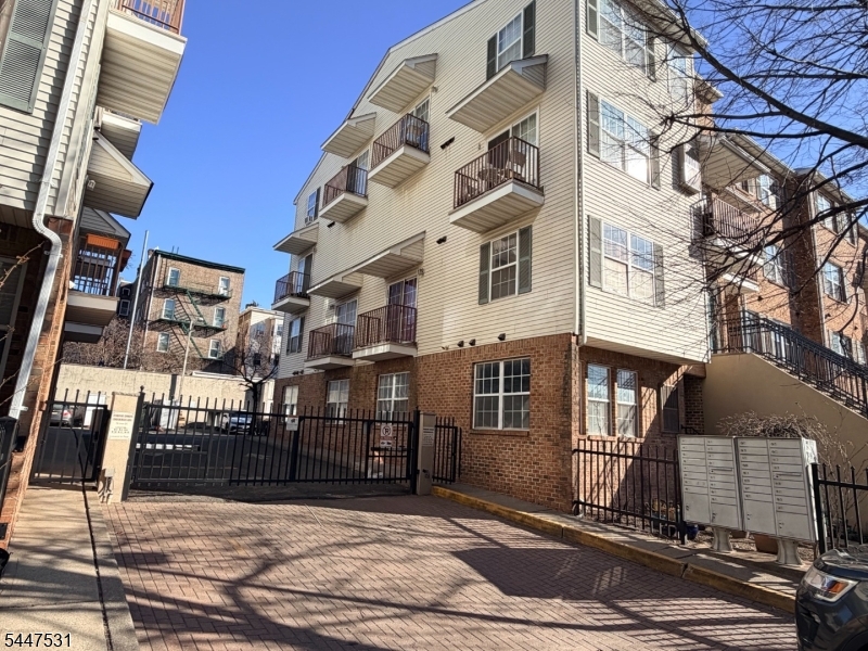 LOCATION, LOCATION, LOCATION! Whether you're a first-time homebuyer searching for the perfect place to call home or an investor looking to add a property in one of Newark's most desirable neighborhoods, this first-floor unit is an opportunity you won't want to miss. Nestled in the heart of the highly sought-after Ironbound section, this home offers exceptional value, convenience, and long-term investment potential.A commuter's dream, the property is located just blocks from Newark Penn Station, providing direct access to New York City in approximately 30 minutes and only 15 minutes from Newark Liberty International Airport. Easy access to major highways makes commuting throughout New Jersey effortless.Inside, the bright open-concept living and dining area is filled with natural light, wood flooring, fresh neutral paint, and abundant windows that create a warm, inviting atmosphere. Additional highlights include updated bathrooms, central air conditioning, an in-unit washer and dryer, generous storage, and a private balcony off the primary bedroom.A gated driveway offers added privacy and security. Enjoy restaurants, cafés, bakeries, and shops along Ferry Street, plus Downtown Newark attractions including the Prudential Center, NJPAC, Whole Foods Market, parks, and cultural venues. An unbeatable location, excellent commuter access, and strong rental appeal make this home an outstanding opportunity for homeowners and investors alike.