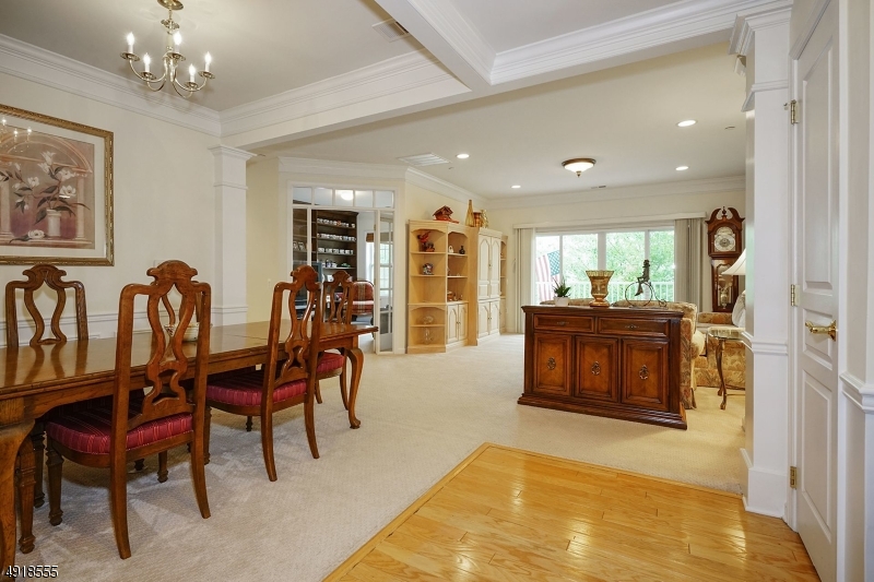 NEW PRICE!  Great Location facing the POND!  Skillfully designed Somerset Run Carriage Home boasts open flow, 9' ceilings, columns, separate Living & Dining Rms. & a French Door opening to a charming den/office.  The generous eat-in kitchen easily accommodates a table for four!  Beautiful Master Suite with Tray Ceiling, Full Bath and Walk In Closet! And there?s tons of storage, including a double pantry in the kitchen, cabinets & shelving in the laundry room, large linen closets in both bathrooms & a separate storage closet on the same floor!  TWO GARAGE SPACES!  Somerset Run is an Active & Inclusive Over 55 Community with a 25,000 s.f. Clubhouse with indoor & outdoor pools, gym, billiard, game & ball rooms.  Minutes to major roads & NJ Transit to NYC.JOIN US!