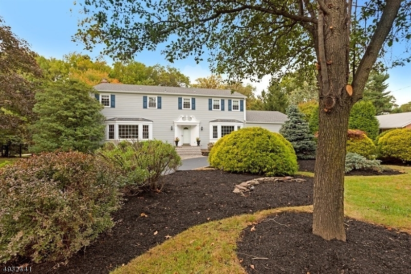 Absolutely gorgeous 5 bedroom, 2.1 bath colonial in fabulous neighborhood!  It doesn't get any better than this!!  Formal living room & dining rooms w/ architectural moldings, hardwood floors & bay windows, family room w/ wood burning fireplace, custom mantle, recessed light opens to sunroom w/ 3 walls of windows & door to the deck, updated kitchen has center island, stainless steel Viking appliances, gas cooktop, an office or bedroom, full bath & laundry complete the first floor.  Second floor offers a beautiful master suite, w/ a private bath, walk-in closet & second closet, 3 additional bedrooms, & updated main bath.  Lower level has space for everything, hobbies, media room, rec room & lots of storage,  The backyard features a deck, a patio, a firepit & lots of green grass.  Walk to all the schools!