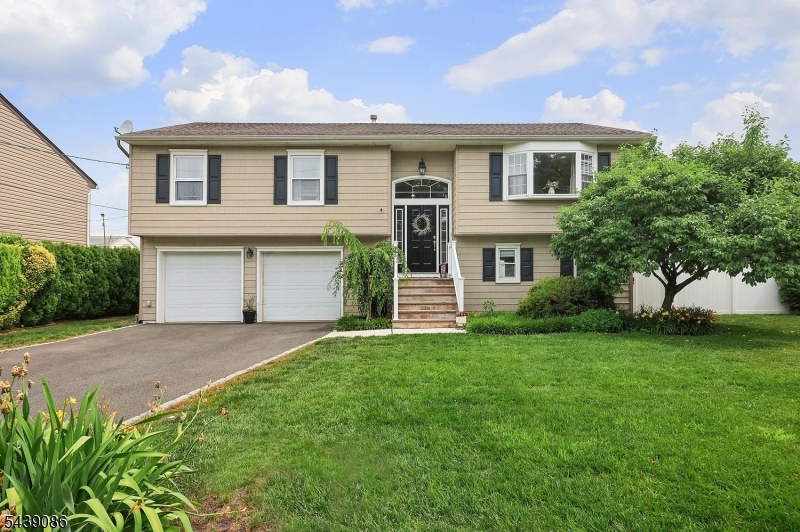 Tucked away on a quiet cul-de-sac, this impeccably maintained 3-bedroom, 2 full bath Bi-Level offers exceptional space both inside and out. Built in 1986 and lovingly cared for, this home reflects pride of ownership at every turn. The main level features a spacious living room with hardwood floors, formal dining room, and an attractive eat-in kitchen with custom cabinetry, granite countertops, tile backsplash, center island, and stainless steel appliances. Three generously sized bedrooms and a full bath complete the upper level. The sunlit ground level provides additional living space with a large family room, den, second full bath, and convenient access to the attached two-car garage. Sliding doors lead to the incredible backyard, a true highlight of the property. Fully fenced and beautifully maintained, the outdoor space is designed for both entertaining and relaxation, featuring a stunning in-ground pool, expansive pool surround, large deck with pergola, and multiple areas to gather with friends. Whether hosting summer celebrations or enjoying a quiet evening outdoors, this backyard retreat is sure to impress. Residents of this cul-de-sac enjoy a friendly, close-knit neighborhood atmosphere that is increasingly hard to find. Located within the Hillside Ave School district, serving students from kindergarten-eighth grade, this move-in ready home offers a wonderful combination of comfort, space, and outdoor enjoyment. Living in Cranford NJ is the dream!