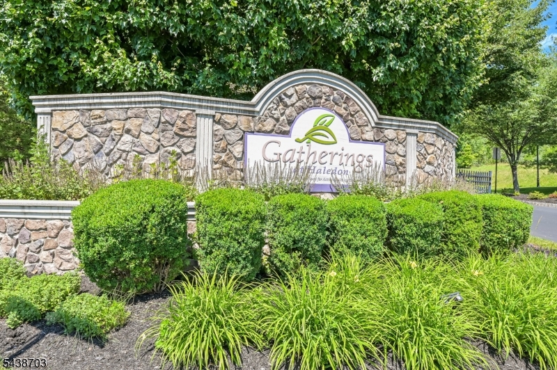 Welcome to The Gatherings, a 55+ community. Beautiful, well maintained, secure building with elevator access. Easy one floor living. NYC views. This model home features two bedrooms & two baths, living room with slider to deck, dining room and kitchen. The eat-in kitchen has beautiful cherry wood cabinets with built-in wine rack, cutting board, pull out drawers, Corian countertop with an integrated sink, tile backsplash, tiled floor & recessed lights. Central air plus ceiling fans in both bedrooms. Spacious primary bedroom has triple windows that provide lots of light and two walk-in closets, 1 with closet system. The primary bath has a fully tiled walk-in shower with integrated seat, double sinks, oil bronzed fixtures. Corian countertop, a separate toilet room & built in linen closet. Second full bath offers tub/shower combo. Entrance has guest closet, wainscoting and crown molding. Beautiful hardwood flrs in both the DR & LR. Full size washer/dryer. This home has ample storage and is ready to move in. The building has an enclosed garage with one designated parking space & a private storage unit. Ample guest parking. Clubhouse is beautiful and offers exercise room, reading room, bathrooms, elevator, gathering room with fireplace, ktichen, billiard room and an outside terrace area perfect for relaxing & entertaining. Conveniently located to shopping, medical offices and highways.
