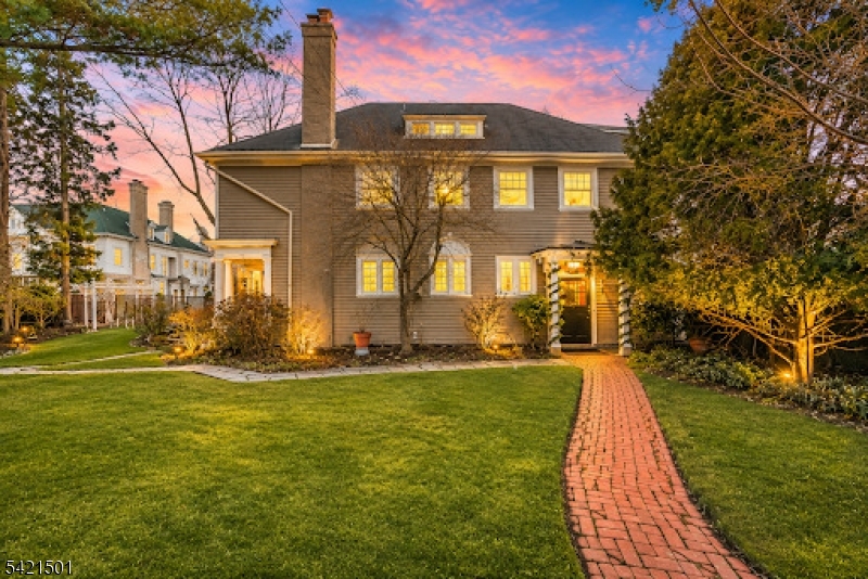 Own a rare piece of Plainfield history at 944 Madison Avenue. This distinctive 3,900 sq ft residence was built in 1897 as the carriage house to the iconic Coriell Mansion, the largest home ever constructed in the Queen City. Located in the Van Wyck Brooks Historic District, the property offers architectural integrity and timeless character rarely found today. The home has been featured in architectural publications and on historic home tours. Original craftsmanship is showcased throughout, including high ceilings, exposed beams, French doors, original wainscoting, stained-glass accents, and leaded transom windows. 5 gas fireplaces add warmth and old-world charm. The kitchen features a Viking range, stainless steel appliances, and a layout designed for entertaining. A generously sized dining room flows seamlessly into the main living areas. Set far off the street, mature hedges provide exceptional privacy. Expansive front and side yards, a detached two-car garage, and inviting outdoor spaces complete the setting. A summer kitchen opens to a patio and screened porch for easy indoor-outdoor living. The ground level offers flexible rooms with a full bath, ideal for a studio, home office, or recreation space. The main living level includes a primary suite, guest bedroom, additional full bath, and open living and dining areas. The third floor provides an additional bedroom or office and a full walk-in attic. A truly exceptional opportunity to own a one-of-a-kind historic residence.