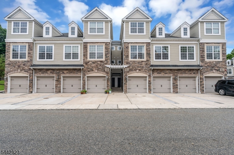 Welcome to Coventry Park, where style, space, and convenience come together in this beautifully maintained 3-bedroom, 2.5-bath interior townhouse. The ground level features a welcoming foyer with garage access, while the main living level offers an open-concept layout with gleaming hardwood floors, a spacious living room, dining area, powder room, and a beautifully appointed kitchen featuring granite countertops, stainless steel appliances, abundant cabinetry, breakfast bar seating, and a stylish tile backsplash perfect for everyday living and entertaining. The upper level offers a spacious primary suite complete with a walk-in closet and private ensuite bath with dual vanity and oversized shower. Two additional bedrooms, a full hall bath, and a convenient laundry room complete the third floor. An attached one-car garage plus assigned parking provide added convenience. Residents of Coventry Park enjoy beautifully maintained grounds, a playground, and low-maintenance living. Ideally located just one mile from the Morris Plains Train Station, commuting to NYC is a breeze. You'll also enjoy quick access to Route 10, Routes 287 and 80, plus endless shopping, dining, and everyday conveniences just minutes from your doorstep. Move right in and enjoy everything this sought-after Morris Plains community has to offer!