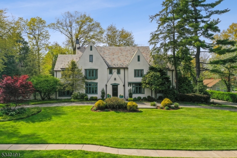 Timeless elegance meets modern luxury in this extraordinary 17-room Normandy Manor estate in South Orange's coveted Montrose section. This magnificent 8-bedroom, 5.1-bath residence seamlessly blends historic grandeur with contemporary sophistication. Thoughtfully restored and meticulously maintained, the home sits on beautifully landscaped grounds and offers an exceptional lifestyle of elegance, comfort, and privacy.A Vermont slate roof and fully restored original windows showcase the home's enduring craftsmanship. Inside, grand formal spaces, intimate gathering rooms, and exquisite details create a refined and welcoming atmosphere. A fully finished lower level provides versatile space for recreation, media, or guest accommodations.Step outside to a private backyard oasis featuring a stunning gunite pool with an integrated spa/hot tub, surrounded by lush gardens and multiple terraces ideal for entertaining or relaxing in total privacy.Luxurious bedroom suites and elegantly updated baths blend timeless charm with modern amenities. Perfectly located on a quiet, tree-lined street, yet just moments from South Orange Village, Midtown Direct trains to NYC, parks, and cultural attractions   this is truly one of South Orange's most iconic and distinguished residences.