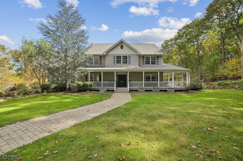 Set on a 18-acre farm-assessed lot this estate is an oasis of peace, privacy & serene country living. The heart of the home is the spacious eat-in kitchen w. a center island breakfast bar & granite counters. Equipped with top-of-the-line SS appliances, including a 48" Viking range w. double oven, this kitchen is a dream that opens onto the deck overlooking the in-ground pool. Venture further into the grand family room w. soaring cathedral ceilings & wood-burning fireplace. The formal dining room is ideal for entertaining, while the 1st floor office & powder room provide convenience. Upstairs, the master suite is your personal haven w. WIC & private ensuite w. oversized shower & spa tub. While 3 additional bedrooms provide comfort for all. In addition, the basement offers access to the 2-car attached garage, large rec room & storage, while the walk-up attic provides added storage. Step outside to discover a 1,000 sqft wrap-around porch & deck. The in-ground pool & hot tub are set within a 1,000+ sqft fenced-in patio making this backyard the ultimate destination. Meanwhile, the 2-car attached & oversized 2-car detached garages offer endless possibilities. Plus, a new septic is being installed. From hunting to riding ATVs, this 18-acre property is perfect for all of your favorite outdoor activities. Enjoy this tranquil escape, while remaining only 1 hour from NYC with easy access to Rt. 78/80/206. Don't miss out on your personal luxury retreat in the heart of NJ!