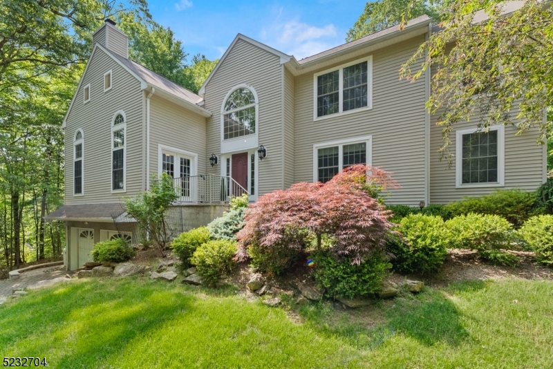 Stunning colonial home in the beautiful Long Valley community! Situated on a sprawling 1-acre lot, this property offers unmatched tranquility & privacy.  Step from a grand foyer into an open concept family room & recently renovated chef's kitchen with s/steel appliances and granite countertops, making it perfect for entertaining. The main floor family room boasts high ceilings, palladium top windows & a beautiful stone wall fireplace.  Enjoy an elegant dining, living room, bedroom or office as well as a large foyer leading to a beautiful staircase. Upstairs, you'll find spacious bedrooms and a fully renovated main bath.  The primary bedroom features tray ceiling, dual walk-in closets and a exquisitely designed ensuite bathroom w/claw foot tub and custom shower, creating a luxurious retreat.  For add'l living space, the finished basement is perfect for a game room, theatre room or a home gym. Step outside to your own private oasis, complete with a swim spa, paver patio, and a retractable pergola. The perfect setting for relaxation or hosting outdoors. Enjoy the convenience of a Whole House Generator! Brand new Septic system, Paver driveway and 2 car oversized garage. Located near a variety of eateries, breweries, hiking trails, parks, farm stands and easy access to NYC.  Part of the highly regarded Long Valley Blue Ribbon schools and W.Morris Central High School with an IB program. Don't miss out on this incredible opportunity to own your dream home!
