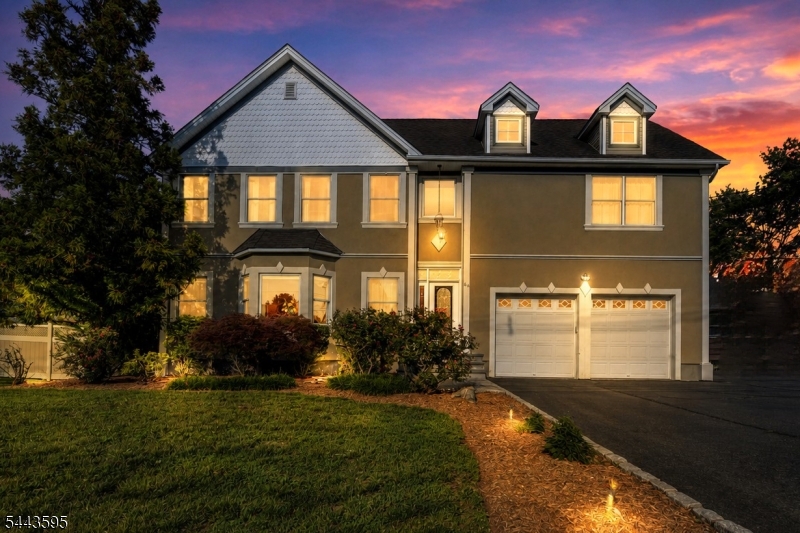 Addition & total renovation done in 2003. Upon entering the grand entrance of this gorgeous home you will see wide open spaces, high ceilings, lots of light w/ beautiful windows, an oversized staircase leading to the 2nd floor, attention to detail & beautiful red oak flooring throughout. The 1st floor features a formal LR w/ an oversized picture window & custom trim & baseboard, a formal DR w/ an arched doorway, beautiful tray ceiling w/ caufered molding, wainscoting, & an inlay floor design. The kitchen features granite countertops & custom wood cabinets, tile backsplash, breakfast bar, SS appliances, & separate dining area. Sliders from the kitchen lead to the backyard patio. The FR off the kitchen has cathedral ceilings w/ 2 skylights, fireplace, recessed lights, & another set of sliders to the backyard patio. There is a half bath off the FR. A side entry foyer off the FR leads to the full basement w/ 8' ceilings & a temperature controlled wine cellar. All BRs are on the 2nd level w/ laundry area. There are 3 nice size BRs & an office w/ a full bath on one side of the staircase. On the other side is a magnificent primary BR suite w/ 11' tray ceiling, 2 walk-in closets & recessed lighting. The primary BR suite has a jacuzzi tub, separate shower stall w/ custom tile & an oversized vanity. This is a great home for entertaining & relaxing after a long day at work. There is a town lake for swimming & fishing, golf course, &  bike/pedestrian walking path. Easy commute to NYC!