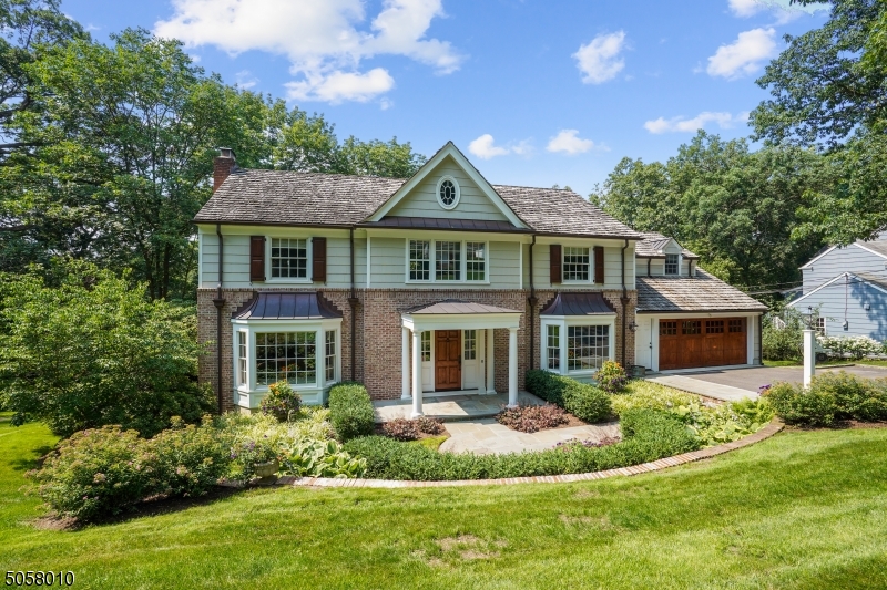 Stunning Center Hall Colonial offers a spacious, move-in ready home in a great location! Renovated throughout w/beautiful curb appeal the airy floorplan begins with a large foyer flanked by a formal dining room & front-to-back living room with FP.  Enjoy a fabulous addition including a Family Room w/FP, vaulted ceiling, custom built-ins & deck access, open concept to the Kitchen w/cent. island and Breakfast Room.  On the second floor is a large Primary Suite w/WIC, custom built-in closet cabinets & an updtd Bath.  There are 4 additional bedrooms & 2 additional bathrooms (one en suite).  The walk-out Lower Level w/FP has high ceilings, great light, versatile finished space, a separate Exercise Area, a powder room, ample storage & laundry.  Modern conveniences include directly entry from the attached 2-car heated garage, a mud area, 1st floor powder room.  Located within close proximity to Brayton Elementary School, Memorial Field Park & easy access to downtown Summit.  This house ticks all the boxes! Fireplaces, chimneys, flues being conveyed in as is condition with no known issues.