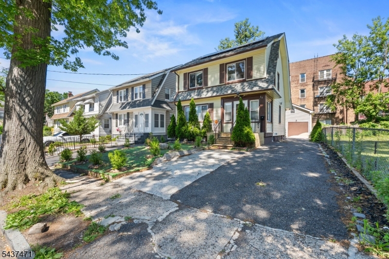 Beautifully updated Colonial offering the perfect blend of charm, space, and modern convenience. The first floor features a bright and inviting living room, formal dining area, full bathroom, and an updated kitchen with stainless steel appliances, ample cabinetry, and plenty of room for everyday living and entertaining. Upstairs, you'll find three generously sized bedrooms and an additional full bathroom. A finished walk-up attic provides valuable bonus space ideal for a home office, playroom, recreation area, fitness space, or media room.Additional highlights include updated flooring, recessed lighting, abundant natural light, a private driveway, detached garage, and a backyard ready for outdoor enjoyment. Conveniently located near shopping, restaurants, schools, parks, public transportation, and major highways, offering an easy commute to Newark, Union, and New York City. Whether you're a first-time buyer or looking for more space, this move-in ready home offers exceptional value and versatility. Don't miss the opportunity to make it yours!