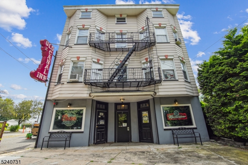Opportunity knocks with this mixed-use building offering an iconic, thriving Restaurant/Bar business with a rich history and 4 residential apartments. Established nearly a century ago, The Old Canal Inn is poised to continue propelling forward. Total patron capacity of 186 including the 75 in the dining room. An extensive craft beer list flows through the 30 taps, with a strong customer base which enjoys the outdoor patio, live entertainment, catering, private parties and the in-house regulation shuffleboard table as well as the 22 large screen TVs. The kitchen and restaurant received a total renovation in 2015. AC systems (2022), Boiler (2020). The property features a thriving hospitality business on the ground floor and four income-producing residential apartments above, creating multiple revenue streams and long-term investment potential. The residential apartments are well-maintained. Turn-key, profitable operation with strong potential for added growth.Ownership will consider selling the business independently, subject to executing a mutually acceptable long-term lease for the restaurant/bar premises. The real estate will not be sold separately prior to the sale of the business. Buyers interested solely in the real estate will not be considered unless they acquire the restaurant/bar business simultaneously.