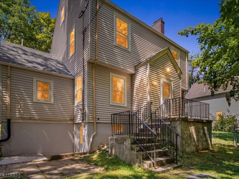 Exceptional Opportunity- Classic Colonial with an Included Buildable Adjacent Lot! Don't miss this rare chance to own a charming, solidly built Colonial plus an included adjacent lot (Block 1813, Lot 13, approximately 100 x 94), offering incredible value, added privacy, and future possibilities. The second lot can be built on or sold. Buyers should conduct their own due diligence regarding permitted uses. Inside, find timeless character with a flexible floor plan designed to meet todays lifestyle. The first-floor bedroom and fully accessibility-modified bathroom could make a great in-law suite, or a private home office. Original hardwood floors add warmth and classic appeal throughout. The spacious living room features a beautiful stone wood-burning fireplace (sold as is with no known issues), creating a cozy focal point for gatherings. An unfinished walk-out basement and walk-up attic provide abundant storage and outstanding potential for future finishing or expansion. Upstairs, a versatile bonus room is ideal as a playroom, media room, home gym, or quiet retreat. Major updates include a brand-new 200-amp electrical panel and a newer Crown boiler, giving buyers added confidence and peace of mind.Ideally located just minutes from shopping, dining, major highways (Routes 10, 46, and I-80), and the Dover Train Station, this property offers the perfect blend of classic charm, modern flexibility, investment potential, and everyday convenience.