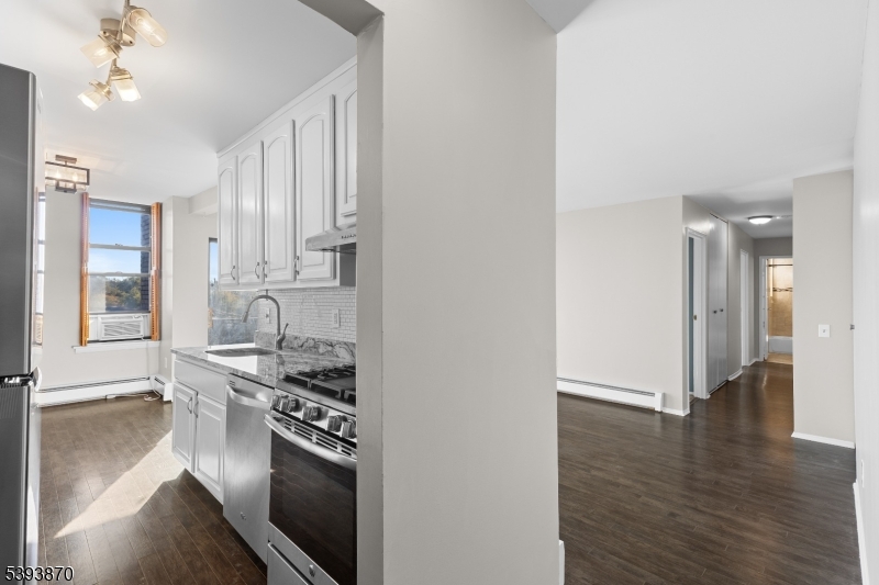 Welcome to effortless living in Nutley's desirable Green Knoll community. Move right into this bright and beautifully maintained 2-bedroom, 1.5-bath condo featuring an open layout, in-unit laundry, and summer pool access. It features a new refrigerator, microwave, washer, and dryer and the landlord covers gas & heat.  The private covered patio is ideal for morning coffee or unwinding at the end of the day.  Enjoy the convenience of two dedicated parking spaces just steps from your door and unbeatable commuter access with bus service at the complex entrance and train stations only minutes away.  Perfectly situated near shopping, dining, parks, and major highways, this home offers the comfort, accessibility, and low-maintenance lifestyle you've been searching for. Don't miss your chance to make this inviting home yours!