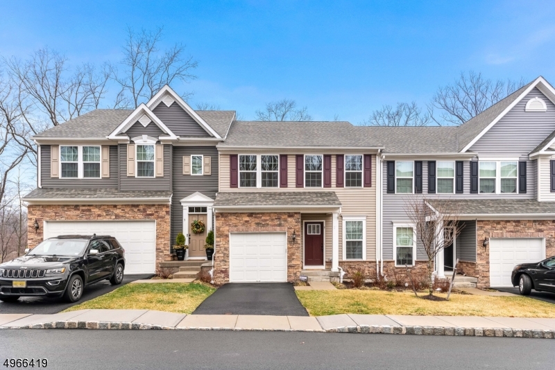 NEW PRICE! GORGEOUS 2 YR YOUNG TOWNHOME IS MOVE IN READY!  IT FEATURES 3 BEDROOMS, 3.5 BATHS & WALKOUT FINISHED BASEMENT IS A HUGE PLUS!  THIS BEAUTY BOASTS A DESIRABLE OPEN FLOOR PLAN, PERFECT FOR ENTERTAINING THE KITCHEN BOASTS A LARGE ISLAND, GRANITE COUNTERTOPS & STAINLESS STEEL APPLIANCES INCLUDING A DOUBLE WALL OVEN. LIVING & DINING RM ARE SPACIOUS & DR HAS SLIDERS THAT LEAD TO DECK. MASTER BEDROOM SUITE WILL IMPRESS ALL. IT FEATURES HIGH CEILINGS LARGE WALK IN CLOSET & FULL BATH THAT OFFERS A GLASS ENCLOSED SHOWER W/ BENCH. 2 OTHER BDRMS, ANOTHER FULL BATH & CONVENIENT 2ND FLR LAUNDRY COMPLETE THIS FLOOR. WALKOUT FINISHED BASEMENT HAS REC RM, FULL BATH, OFFICE & STORAGE - OTHER FEATURES INCLUDE PUBLIC UTILITIES &1 CAR GARAGE. PERFECT LOCATION- JUST 1.5 MILES FROM TRAIN STATION, MAJOR HWYS & SHOPPING.