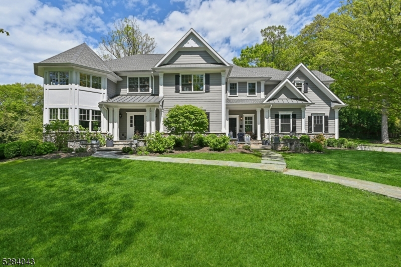 Welcome to luxury living at its finest! Nestled in a prestigious section of Short Hills, this exquisite 6 BD/6.5BA home offers unparalleled elegance & modern comfort. Built in 2015, this center hall colonial boasts impeccable craftsmanship & attention to detail throughout. Enter through the impressive 2-story foyer, setting the tone for the elegance & sophistication found throughout the home.The heart of the home features a chef's dream kitchen equipped w/ top-of-the-line Thermador SS appliances, double ovens & ample counter space for culinary endeavors. Enjoy the 2-car garage conveniently located off the kitchen, w/ a mudroom & side entrance. Cozy up in the spacious living area by the gas fireplace, creating a warm & inviting atmosphere. Enjoy the convenience of a 1st-floor bed w/ an ensuite bathroom, perfect for guests or multi-generational living. W/ 6 beds & 6.5 full baths, this home provides ample space for living & entertaining guests.Retreat to the primary bed featuring a coffered ceiling, 2 separate closets & a spa-like ensuite bath w/ 5-point amenities. Each of the 5 upstairs beds boasts its own ensuite bath, providing privacy & convenience for every member of the household. The expansive basement offers endless possibilities for recreation & relaxation, including a large hidden room behind a built-in feature (ask for details on accessing this unique space). The exterior of the home is professionally landscaped, adding to its curb appeal & creating an outdoor oasis.