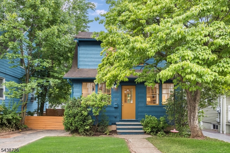 Charming and full of character, this classic Colonial cottage offers the perfect blend of timeless appeal and modern convenience in a sought-after West Orange location. The welcoming enclosed front porch sets the tone for the warm and inviting interior, featuring three bedrooms and a thoughtfully updated kitchen that opens seamlessly to the dining room ideal for everyday living and entertaining. Outside, the property truly shines with exceptional outdoor living spaces. Enjoy gatherings on the raised deck adjacent to the garage and additional entertaining space in the driveway area, creating a unique and versatile outdoor retreat. The oversized two-car garage is a rare find, complete with an unexpected artist's loft above featuring a convenient half bath perfect as a creative studio, workspace, hobby room, or private getaway. Ideally located in the popular Redwood Elementary School district, this home offers easy access to everyday conveniences and commuter options. Nestled between both the Orange and Montclair's Bay Street train stations and just moments from the Mississippi Loop bus stop, commuting is a breeze. Recreation and shopping are equally convenient, with the West Orange town pool, Essex Green mall, Whole Foods, Target, CVS, restaurants, and local amenities all nearby. A wonderful opportunity to enjoy classic Colonial charm, flexible bonus space, and an unbeatable location in the heart of West Orange.