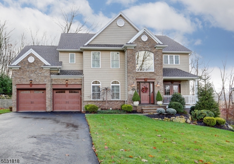 WOW! GORGEOUS CUSTOM BUILT COLONIAL NESTLED IN HUNTER VIEW ESTATES! Come fall in love from the moment you enter the foyer, w/cathedral ceilings, hardwood floors, marble gas fireplace, and LOADS of upgrades and amenities! Light, bright and spacious room EVERYWHERE! Open floor concept kitchen and living room, granite countertops, custom tile backsplash, stainless steal appliances, reverse osmosis, butlers pantry w/wet bar leads to 1st floor office w/french doors and access to covered front deck. 2nd level MB w/MB suite, custom floor to wall closets/drawers, 3 additional generous size bdrms, Jack&Jill bath, pull down attic stairs. NEWER finished basement w/ approved in-law suite w/wet bar, wine fridge, w/d on both floors, radiant bathroom flooring, walk-out to gorgeous deck and private fenced in yard!