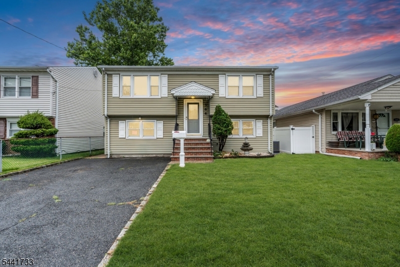 Welcome to this well-maintained and thoughtfully updated bi-level home offering exceptional flexibility and comfort. The main level features three bedrooms, a full bathroom, freshly painted interior, and beautifully refinished hardwood floors that add warmth and character.  The bright and inviting living spaces flow seamlessly into the updated kitchen, creating an ideal setting for everyday living and entertaining. The lower level offers additional living space complete with a second full bathroom and a second kitchen, providing versatile options for extended living, recreation, or entertaining. Recent improvements include a new central air conditioning, newer vinyl siding, replacement windows, exterior doors, and front porch.  Step outside to enjoy the spacious trex deck overlooking the fenced backyard, perfect for outdoor gatherings, gardening, or relaxation. A detached shed with electricity provides excellent storage, workshop space, or hobby area. Conveniently located and move-in ready, this home combines modern updates, functional living space, and outdoor amenities.  Imagine putting your key in the front door and making this house your home!