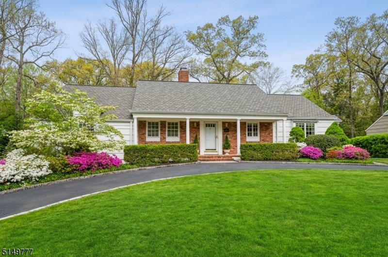 Spacious & stunning 3BD, 21/2 BTHs Ranch is situated in the sought-after Bradwahl section of Morristown. This home is conveniently located just a few minutes away to downtown shops & eateries, Loantaka Park hiking trails & walking distance to the NYC Direct Train station for an easy commute. Set on a beautifully manicured lot on a quiet, tree-lined St, this home features a semi-circular driveway w/stone pavers, a front porch, an attached 2 car garage, a finished basement, 2 fireplaces & open full walk-up attic w/vast potential to expand. Featuring hardwood floors & crown molding, the main level flows from the foyer to the warm LR centered by a wood-burning fireplace. The formal DR w/a chair rail offers the perfect balance for casual & formal entertaining alike. The eat-in kitchen boasts zodiaq engineered stone counters, high-end appliances & custom cabinetry including a built-in workstation & window seat. The main level continues down the hall to the primary BD w/2 large closets & private BTH, 2 additional BDs & a full BTH in the hallway. The finished basement offers an expansive rec-room w/multiple windows letting in lots of natural light. This space includes a wall of natural brick surrounding a cozy fireplace w/a wood-burning insert, plus a 1/2 BTH & a walk-out to the backyard. To top it all off, a sweeping front lawn & flowering shrubs add to the curb appeal, while the lush back yard is bordered w/mature plantings for privacy & plenty of space to garden, relax & enjoy.