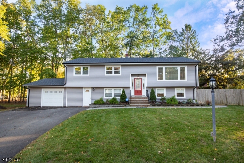 Beautifully Updated 4 bedroom 2.5 bath 2484 Sq Ft bi-level on large flat lot at the end of a cul-de-sac. Home features brand new roof, siding, flooring, cabinets, and countertops. Formal dining room, center island chef kitchen, full bath off the master bedroom. Walk out the kitchen sliders to the deck for entertaining and walk down to your beautiful patio and fenced in yard. This home is a must see and wont last long!!!