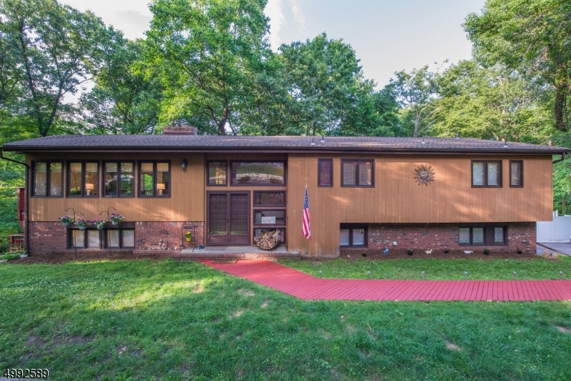 Nestled in the rolling hills & pristine forests of Sussex County, rests this Executive home in a small private community of Forest Lakes. The main floor offers the Master en suite with dressing room and second bedroom. The kitchen with granite countertops, custom tile backsplash, center island, built in desk, wet-bar, wine refrigerator, Sub-Zero refrigerator, and separate eating area is an entertainers delight! With a formal dining room, large living room with fireplace, & recently updated main bath completing this level.  Proceeding to the lower level using the front or back staircase is a large family room with a second fireplace, dry bar, wine refrigerator, & sliders to the outside entertainment area. 2 more bedrooms plus a bonus room, full bath, & laundry. Navien high eff. 5 ZN heat (2018) & Roof (2015).