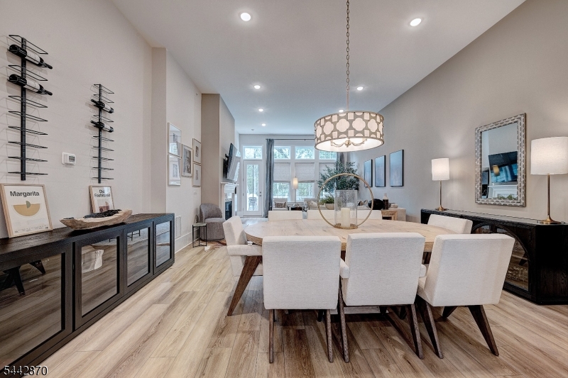 Experience refined living in this exceptional Pratt II model at the Enclave at Hillandale, a boutique luxury townhome community surrounded by the natural beauty of the Roxiticus Valley. This luxury townhome blends sophisticated finishes, abundant natural light & thoughtful design. The sun filled great room features a fireplace & oversized windows, while the gourmet kitchen offers custom cabinetry, SS appliances, spacious center island with seating & seamless access to the dining area. Composite deck overlooks the valley. The 1st floor primary suite features a custom closet system and spa bath with dual vanities, oversized shower & soaking tub. A mudroom, pantry, custom laundry rm storage, and garage with epoxy finished flr added cabinetry & loft storage enhance everyday convenience. Upstairs, a versatile loft, 2 additional Bedrooms, including one with a custom closet system, private office with French doors, and full bath offer exceptional flexibility. The finished walkout lower level adds 1000+ sq ft of living space with a gym & recreation area, rough plumbing for a future full bath, and a large bar ready to be installed or customized. Sliding doors lead to a private patio. Enjoy easy access to 120 acre Mosle Park Recreation Area with scenic trails, athletic fields, and nature views. Nearby Pendry Natirar offers acclaimed dining, walking trails, cooking classes & seasonal events. Conveniently located near both the Peapack & Gladstone train stations with rail service to NYC.
