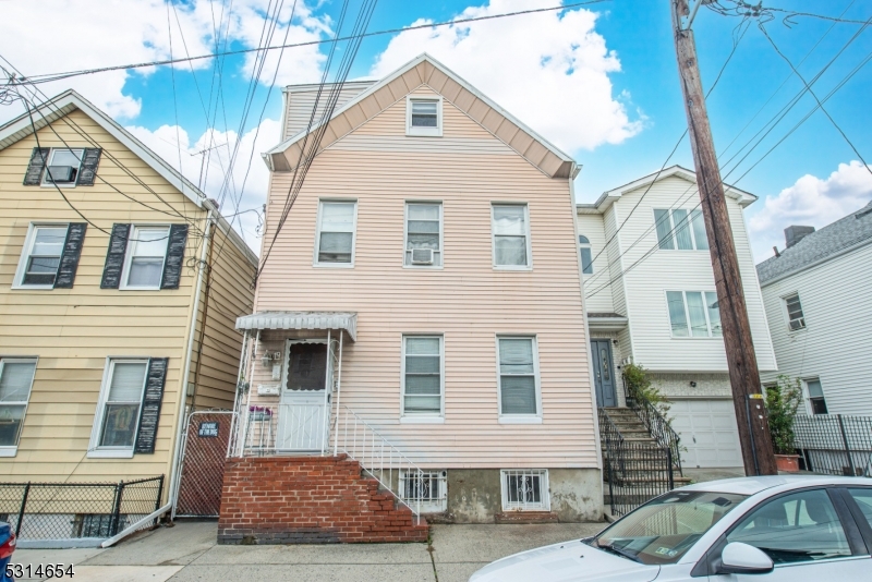 GREAT INVESTMENT PROPERTY IN THE HEART OF THE IRONBOUND SECTION OF NEWARK!  Estate Sale! Great opportunity to own a two family-possibly three family  investment property! Rent two units & live in the other.  Buyer to do due diligence, waiting for proof from town.  First floor has three, large bedrooms with ceiling fans, plenty of natural lighting, large eat in kitchen with plenty of kitchen cabinets, full large bathroom, walk in closet, computer room, open porch, full basement & yard; 2nd floor is rented with great tenants, one bedroom, large living area, kitchen & bathroom; third floor has a separate entrance, open floor plan with large living/kitchen area, bedroom & bathroom.  House is being sold strictly "As Is." Separate Utilities, two furnaces, two gas meters, two hot water heaters, fuel Gas Natural, public water/sewer.  Within walking distance to restaurants, retail stores, local grocery stores, public transportation & easy access to all major routes. Property is being sold with the second floor tenant. C. of O. has already been obtained.  Amazing low taxes!