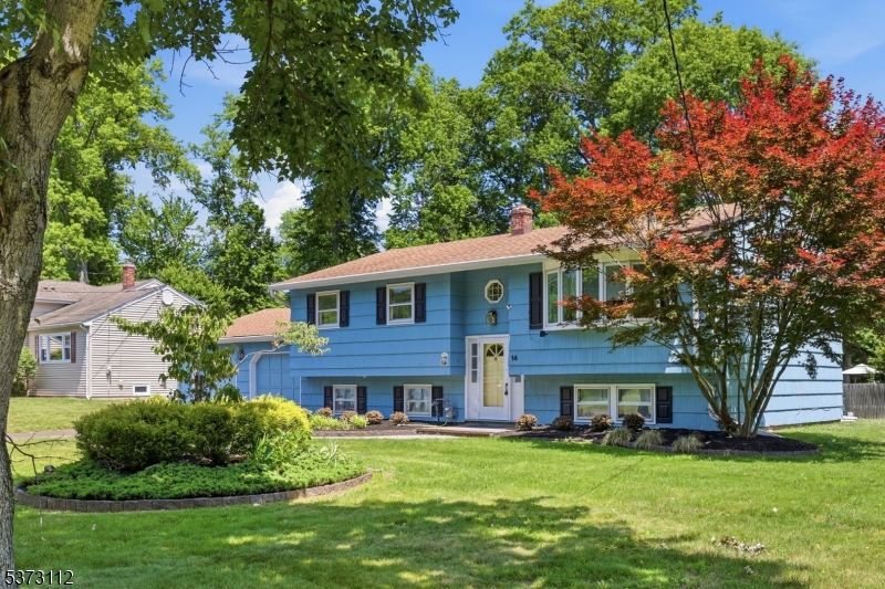 This meticulously cared for Bi-Level home, owned by its original owners, blends timeless charm with modern updates. The remodeled Kitchen is equipped w/a gas cooktop, double wall oven, new dishwasher as well as a microwave  which are perfect for both everyday meals & entertaining. Glistening refinished hardwood floors grace the main level, while the lower level has durable vinyl plank flooring. This home also offers exquisite wood thermopane tilt in windows, Updated baths as well as a large workshop and laundry area which offer added functionality. Interior also boasts a neutral color palette that invites easy customization. Outside, the well maintained exterior complements the serene yard which is also visible from the beautiful screened in porch. C/A 2025, Gas Furnace 2015, HWH 2015, which all ensure comfort year long. Garage has a ceiling mounted heater for that mechanic at heart!