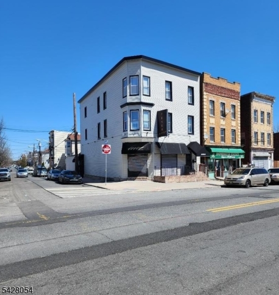 Great multi-family building with two 4BR/2BA apartments and approximately 3,000 SF of prime ground-floor commercial space in the heart of Newark's University Heights district. The ground floor was formerly operated as a lounge and is wide-open, featuring two existing bar setups areas and an adaptable layout ideal for a restaurant or cafe. Positioned just minutes from Rutgers University, NJIT, Essex County College, major hospitals, and premier attractions like NJPAC and Prudential Center, this location enjoys strong foot traffic and excellent visibility. The surrounding area is dense with students, professionals, and daily commuters, offering a built-in audience. Two bar areas in place with high ceilings and flexible interior layout.  Prominent frontage along Central Avenue, steps from public transportation and major highways.  Surrounded by colleges, hospitals, and downtown amenities in one of Newark's most dynamic and fast-growing corridors. Liquor License Can be purchased separately  for $155,000