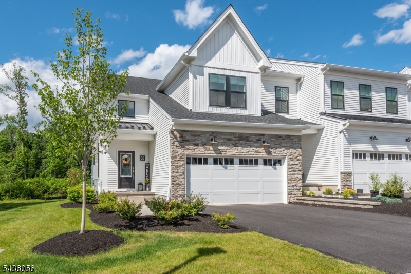 Discover this stunning Marchand Elite end-unit featuring a 1st floor primary bedroom suite no longer available in new models. This home has a welcoming, light filled, two-story entry foyer leading to a beautifully designed kitchen with plenty of cabinet space, quartz countertops, premium appliances, a walk-in pantry, a central island with seating and a separate dining area. The great room has access to the rear deck perfect for relaxing and equally nice for entertaining guests. The primary suite is designed for quiet comfort featuring a fabulous custom walk-in closet and an upscale bathroom with a double vanity and a roomy shower with built-in bench. A powder room, laundry room and garage entrance are also located on the first floor for convenient accessibility. Upstairs you'll find two bedrooms with walk-in closets, an office, a full bath and a spacious loft area offering flexibility for various uses such as a family room, play area, or relaxation zone. The finished basement is ideal for a home theater or rec room equipped with built-in speakers and, a powder room. Upgrades in the home include luxury vinyl plank flooring, enhanced lighting & superior tile and fixtures.  An amazing home designed with refined luxury and a comfortable layout. The community features an outdoor pool, resort style clubhouse, fitness center and patio. All of this is located close to highways, transportation, shopping, restaurants, parks, and, County College of Morris is right down the road!