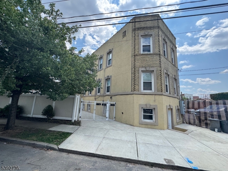 Charming two family home in Newark's prime Ironbound section. Spacious three bedroom apartments offer central air & heat and access to coin operated laundry washing machine and dryer. A quaint nearby mini park and ample street parking. Recent updates include a new roof in (2015), new windows (2017) first and second floor, interior renovations (2017) and recently second floor (2025), redone sidewalk (2018) and a cement patio with shed in a large backyard! Boilers replaced all less than five years, and security cameras on property!   Great opportunity!