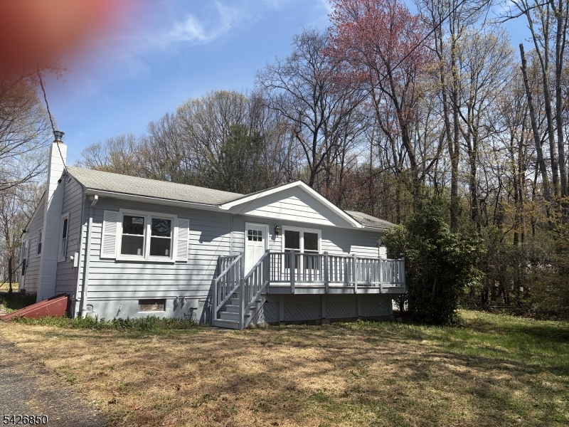 TERRIFIC OPPORTUNITY ON PRIME, SPRAWLING 1.8+ ACRE LOT! CALLING ALL CONTRACTORS, REHABBERS, AND BUYERS WITH VISION! RAISED Ranch home on a beautiful, private lot with incredible scenic views.4bedroom, 2.1 bath ,Dining Room, Living Room, Mud Room,Rec Room Laundry, Storage and more!  plenty of parking for over 6 cars  and a two car detached garage and more.Home needs a total kitchen &  bathrooms  &  much vision for their dream home.  Incredible bonus room with fireplace  in lower level with walk out to large rear yard. Has new plumbing and electric upgrades. FRESHLY PAINTED.