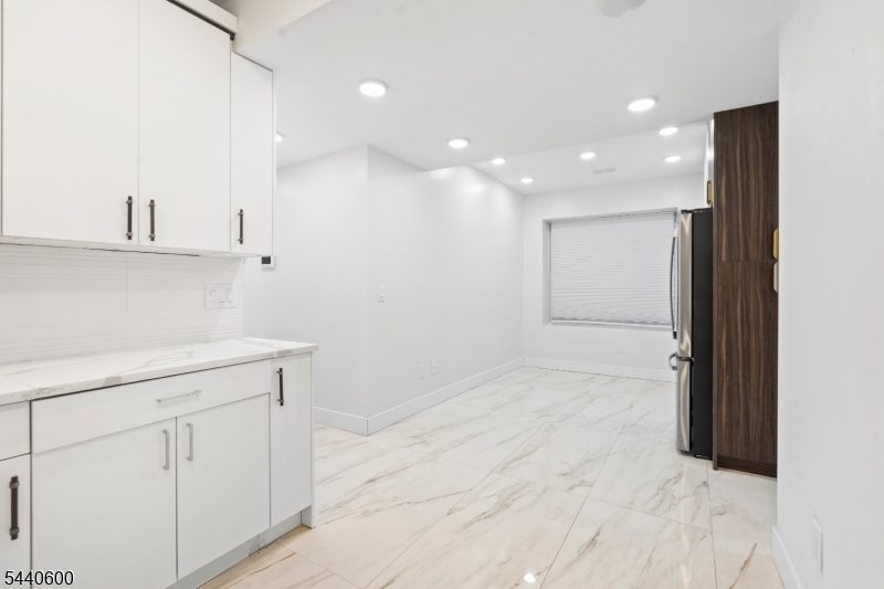 Welcome to this spacious and inviting 5 bedroom, 2 full bath, 2 half bath first floor rental in Jersey City. Offering plenty of room to live, work, and entertain, this home features generously sized bedrooms, comfortable living areas, and a private backyard perfect for relaxing or enjoying time outdoors. Conveniently located near shopping, restaurants, parks, schools, major highways, and public transportation, you'll have easy access to everything Jersey City has to offer, along with a convenient commute to New York City. A rare opportunity to enjoy the space and comfort of a home in a great location.