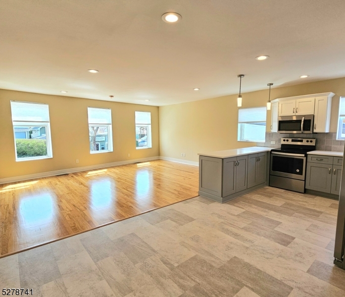 Welcome to your newly renovated 2nd floor, 2-bedroom apartment in the heart of Union, NJ! This modern residence offers a perfect blend of comfort and style. Step into a space where every detail has been meticulously crafted for your convenience. The open-concept living area boasts abundant natural light, creating a warm and inviting atmosphere. The kitchen features sleek counter tops, stainless steel appliances, and ample cabinet space, perfect for culinary enthusiasts. Plus, enjoy the added convenience of having a washer and dryer right in the unit. Retreat to the spacious bedrooms, each offering a tranquil oasis for relaxation. With hardwood floors throughout and contemporary finishes, this apartment exudes sophistication. Conveniently located near shops, restaurants, and public transportation. Don't miss the opportunity to make this renovated gem your new home!