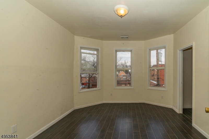 Newly renovated MULTI FAMILY home perfect for an investor or home owner looking to purchase their first home while having income coming in from the other unit.  Each floor is equipped with newly installed floors, 3 bed rooms, 1 bath and updated kitchen.